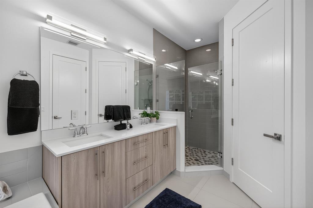 737 Southeast 1st Court, Unit 737 Pompano Beach, FL 33060 - Photo 27 of 53 a bathroom with a double vanity sink mirror and shower