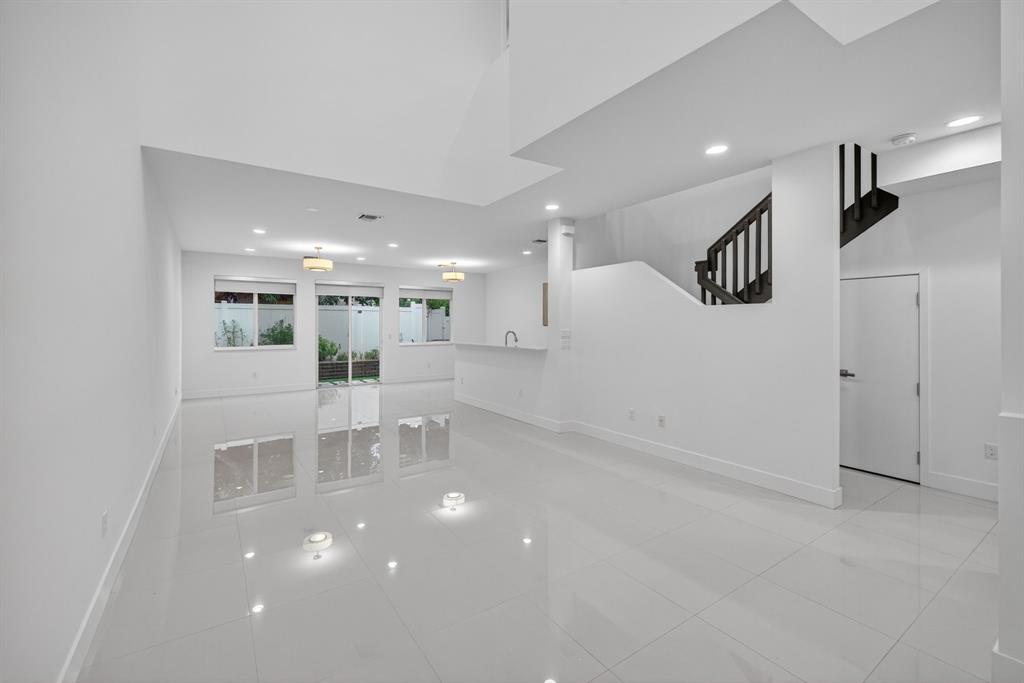 737 Southeast 1st Court, Unit 737 Pompano Beach, FL 33060 - Photo 3 of 53 a view of a living room and kitchen