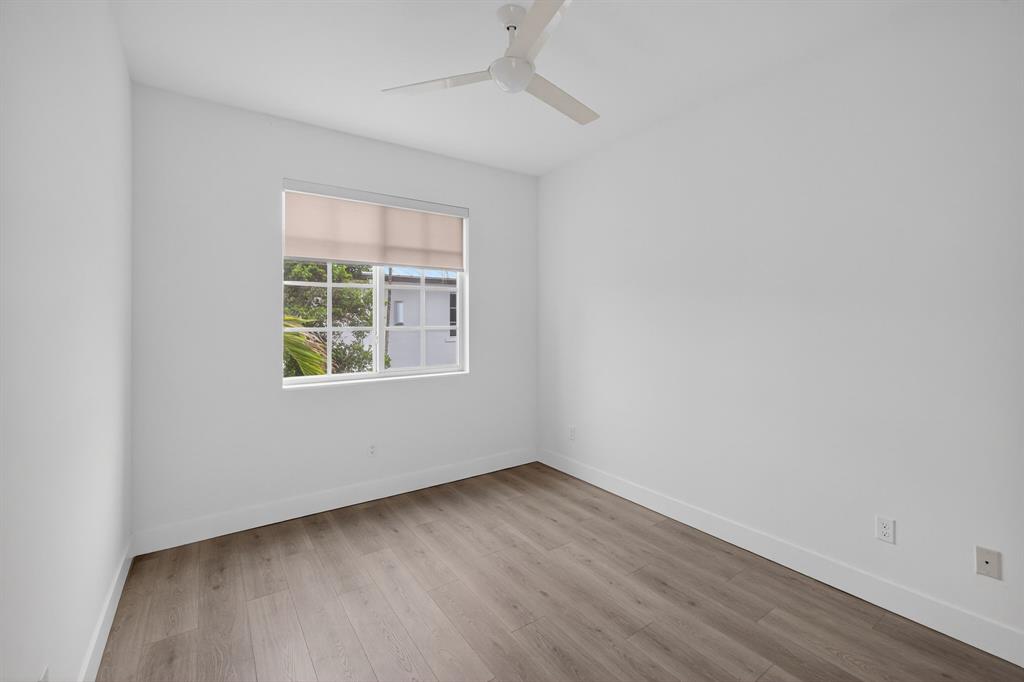 737 Southeast 1st Court, Unit 737 Pompano Beach, FL 33060 - Photo 39 of 53 an empty room with a window