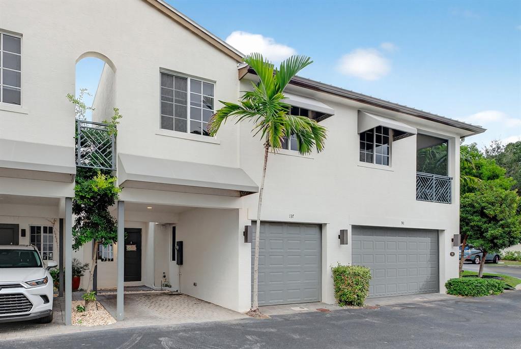 737 Southeast 1st Court, Unit 737 Pompano Beach, FL 33060 - Photo 40 of 53 a front view of a house with garage