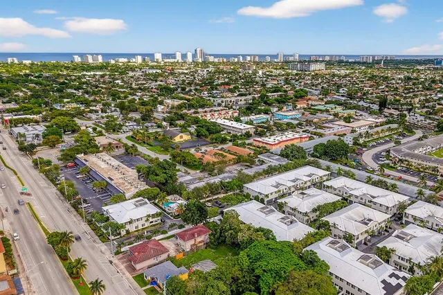 an aerial view of residential houses with outdoor space