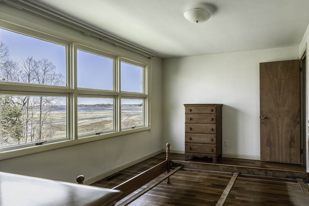 235 Argilla Road Ipswich, MA 01938 - Photo 13 of 28 an empty room with windows