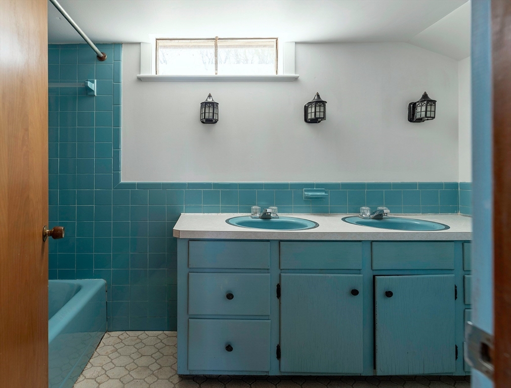 235 Argilla Road Ipswich, MA 01938 - Photo 15 of 28 a bathroom with a sink and a mirror