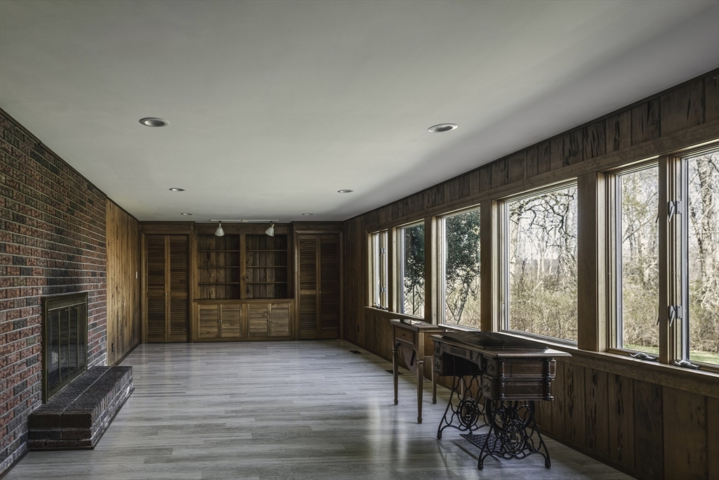 235 Argilla Road Ipswich, MA 01938 - Photo 16 of 28 a view of an empty room with wooden floor and a window