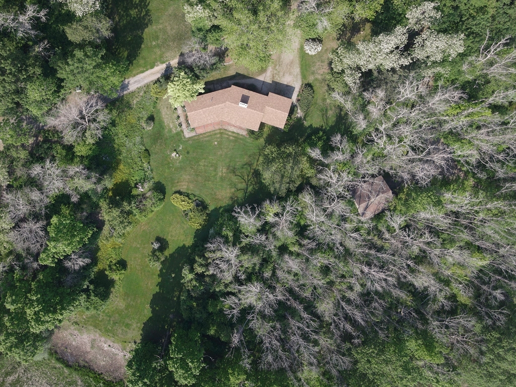 235 Argilla Road Ipswich, MA 01938 - Photo 21 of 28 an aerial view of residential house with outdoor space and trees all around