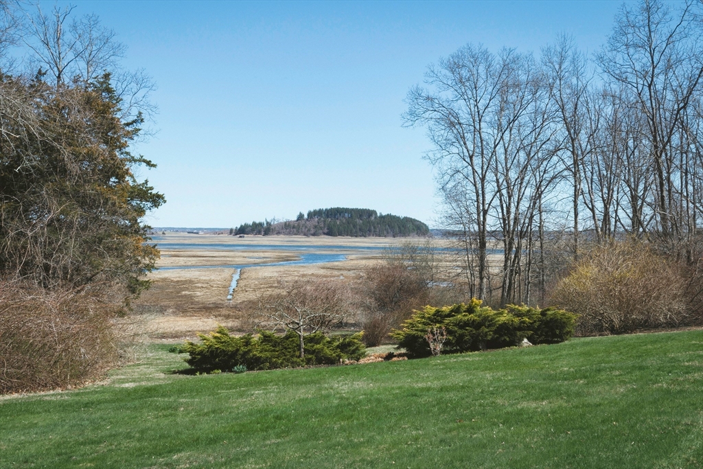 235 Argilla Road Ipswich, MA 01938 - Photo 26 of 28 a view of a lake with a yard