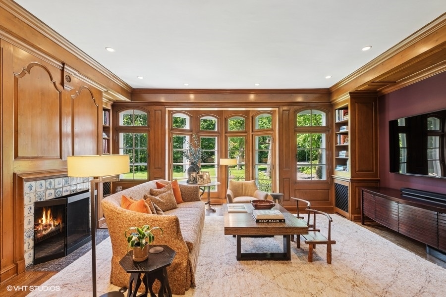 855 Sheridan Road Highland Park, IL 60035 - Photo 19 of 62 a living room with furniture a fireplace and large windows