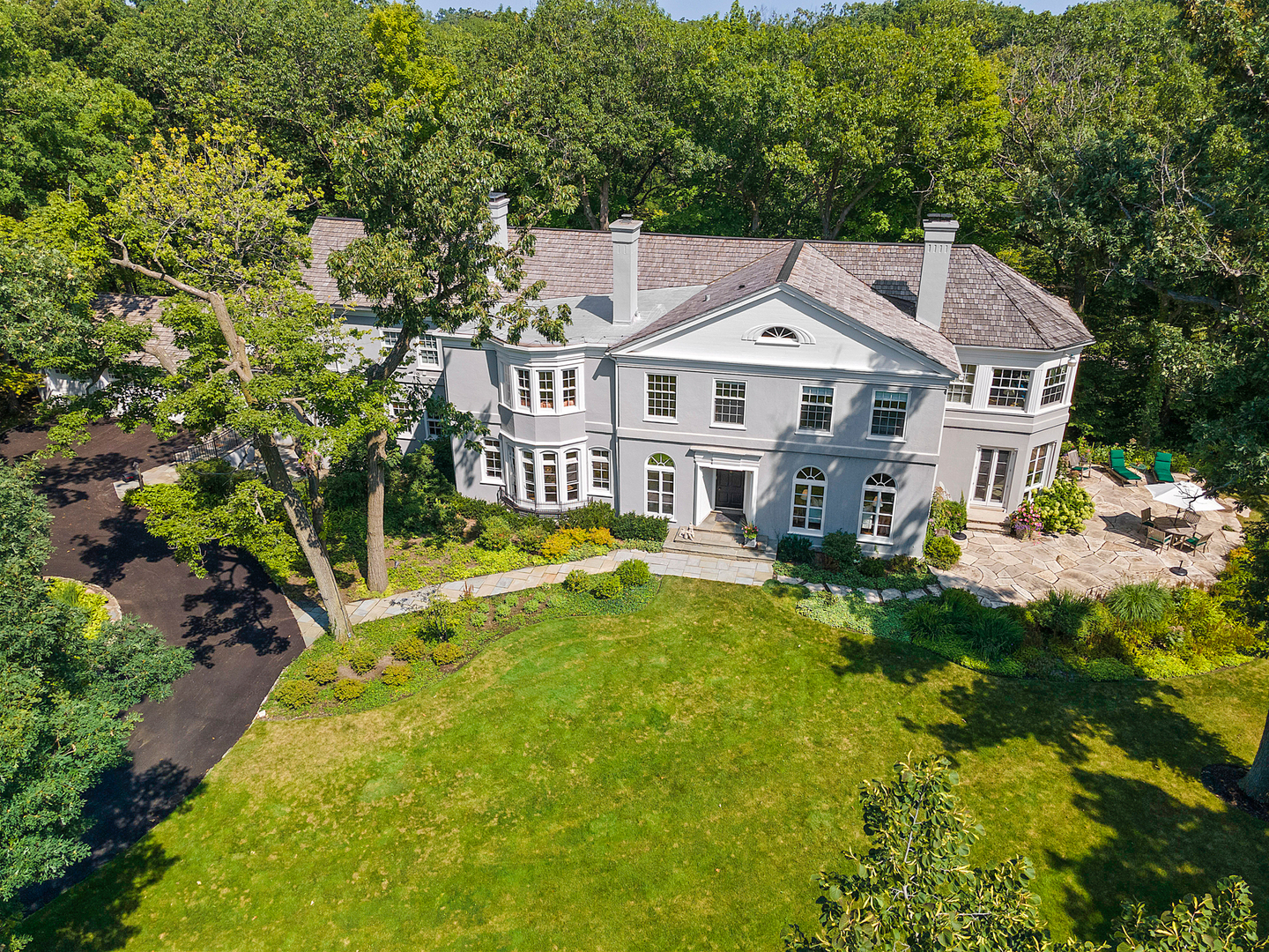 855 Sheridan Road Highland Park, IL 60035 - Photo 3 of 62 a front view of a house with swimming pool