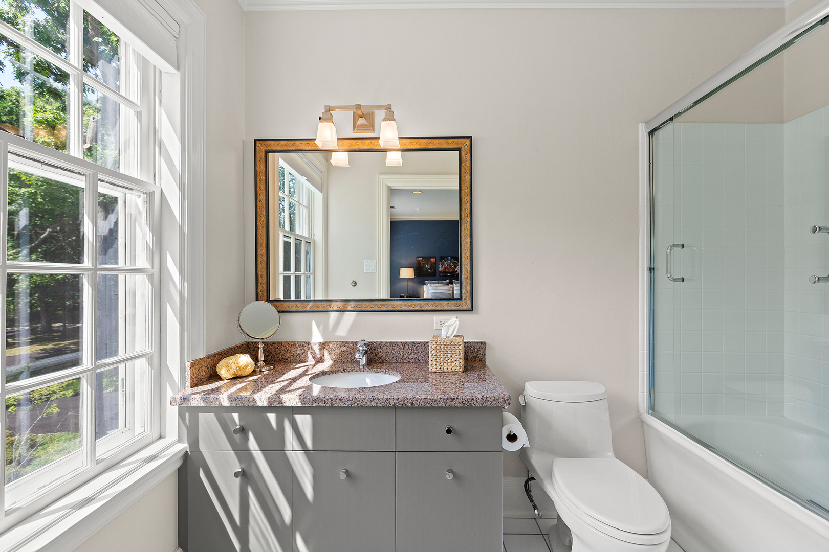 855 Sheridan Road Highland Park, IL 60035 - Photo 35 of 62 a bathroom with a granite countertop sink toilet and mirror