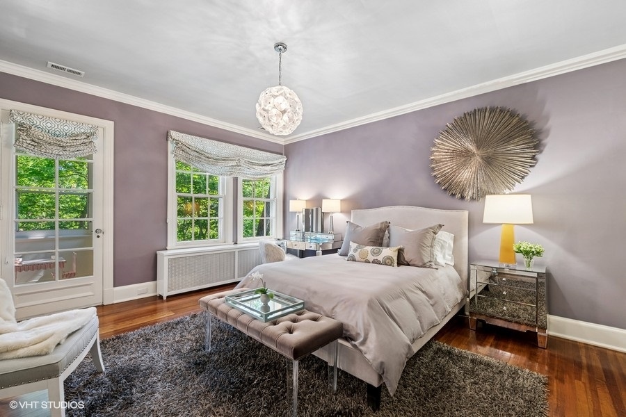 855 Sheridan Road Highland Park, IL 60035 - Photo 39 of 62 a bedroom with a bed mirror and window