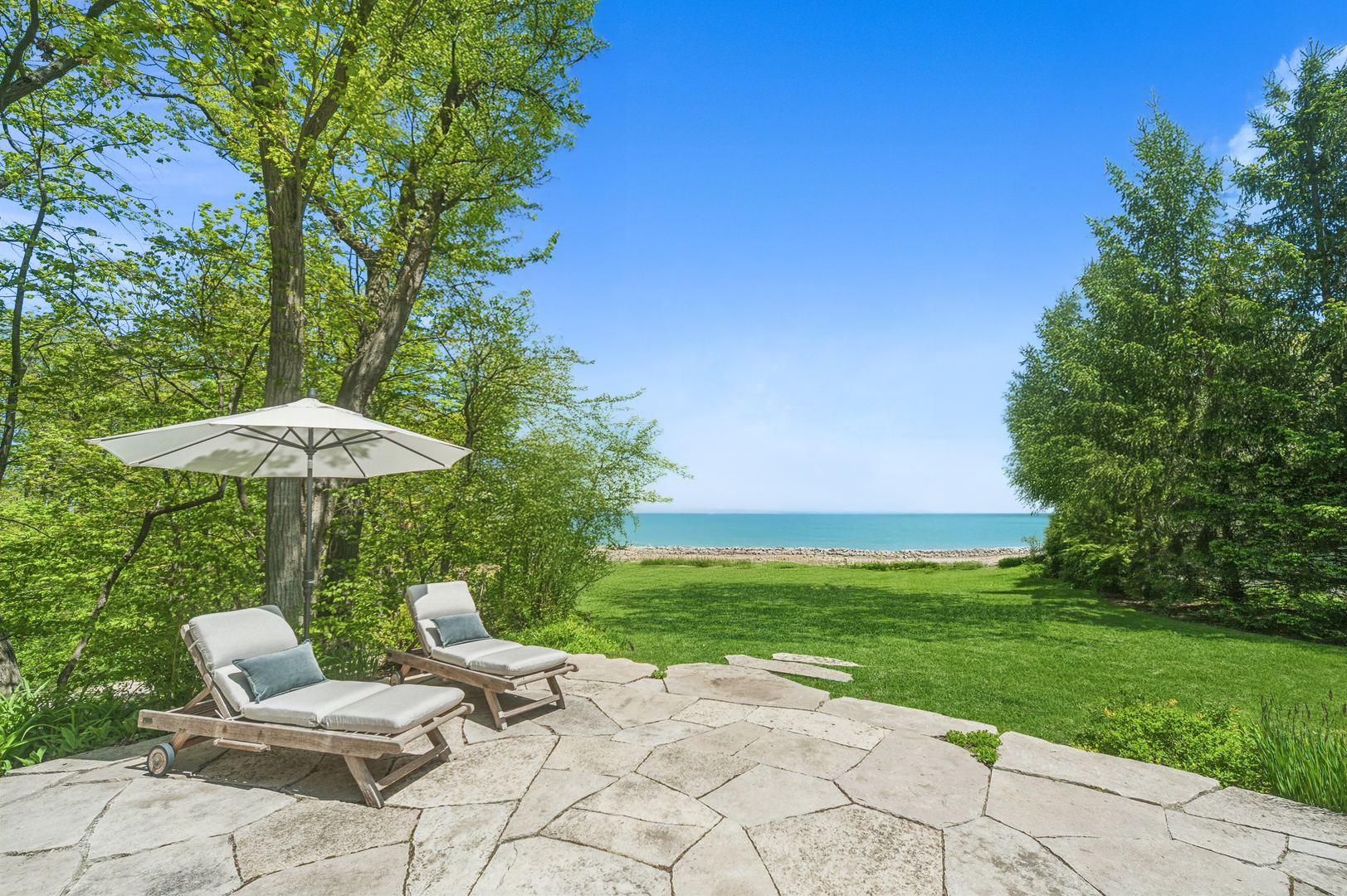 855 Sheridan Road Highland Park, IL 60035 - Photo 55 of 62 a view of a backyard with furniture and a garden