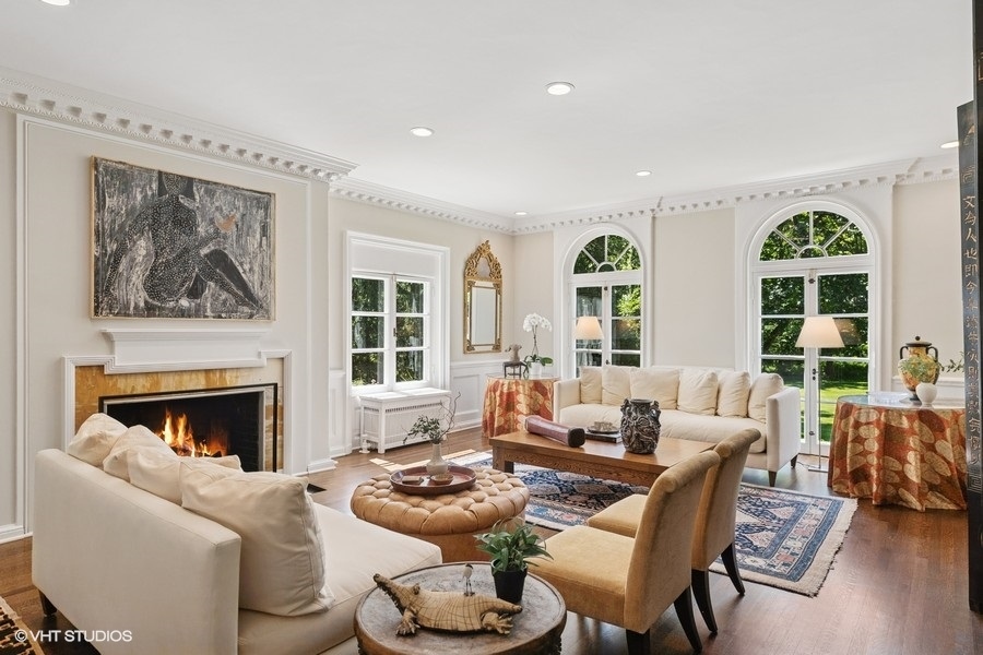 855 Sheridan Road Highland Park, IL 60035 - Photo 9 of 62 a living room with furniture and a fireplace