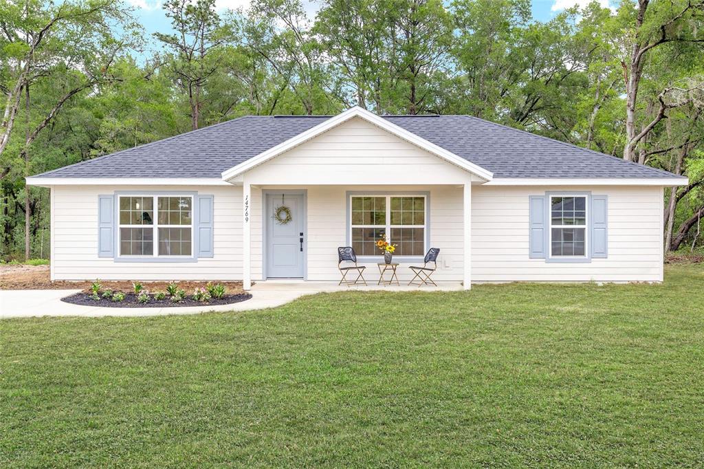 14769 Southwest 24th Place Ocala, FL 34481 - Photo 1 of 33 a front view of house with yard and green space
