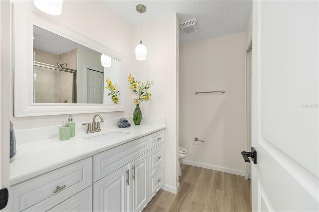 14769 Southwest 24th Place Ocala, FL 34481 - Photo 19 of 33 a bathroom with a double vanity sink and mirror
