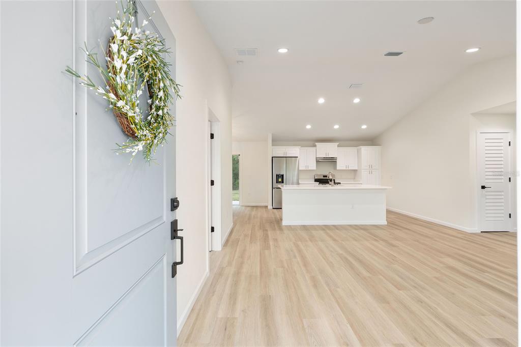 14769 Southwest 24th Place Ocala, FL 34481 - Photo 3 of 33 a view of a kitchen with wooden floor