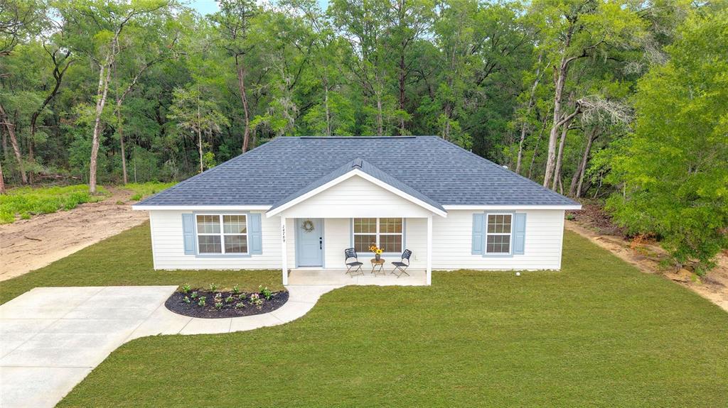 14769 Southwest 24th Place Ocala, FL 34481 - Photo 32 of 33 front view of a house with a yard