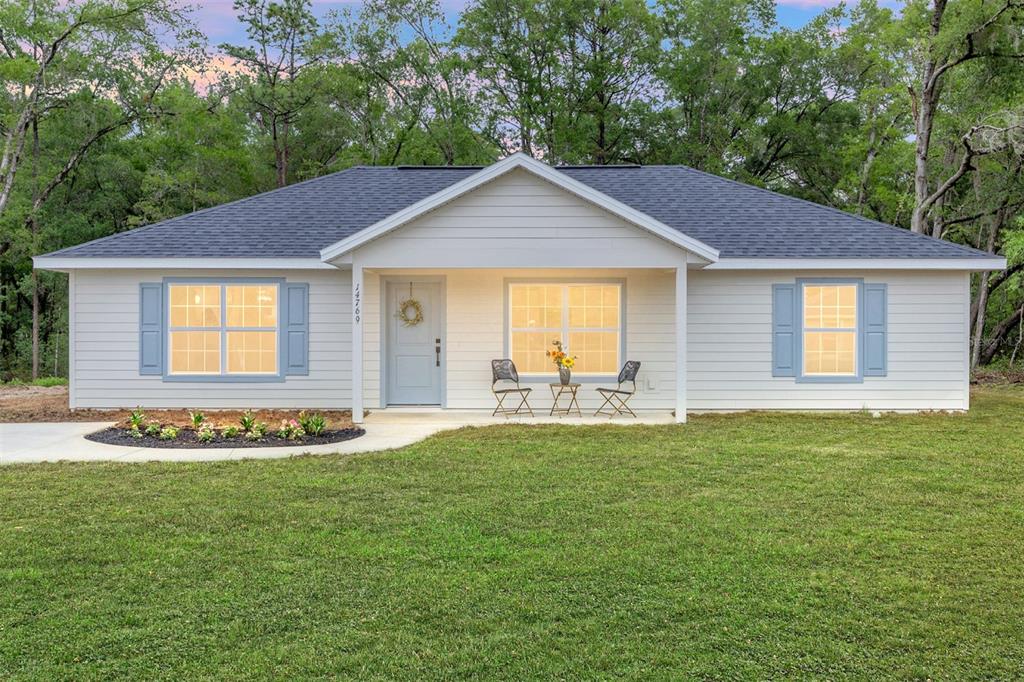 14769 Southwest 24th Place Ocala, FL 34481 - Photo 33 of 33 a front view of a house with a yard