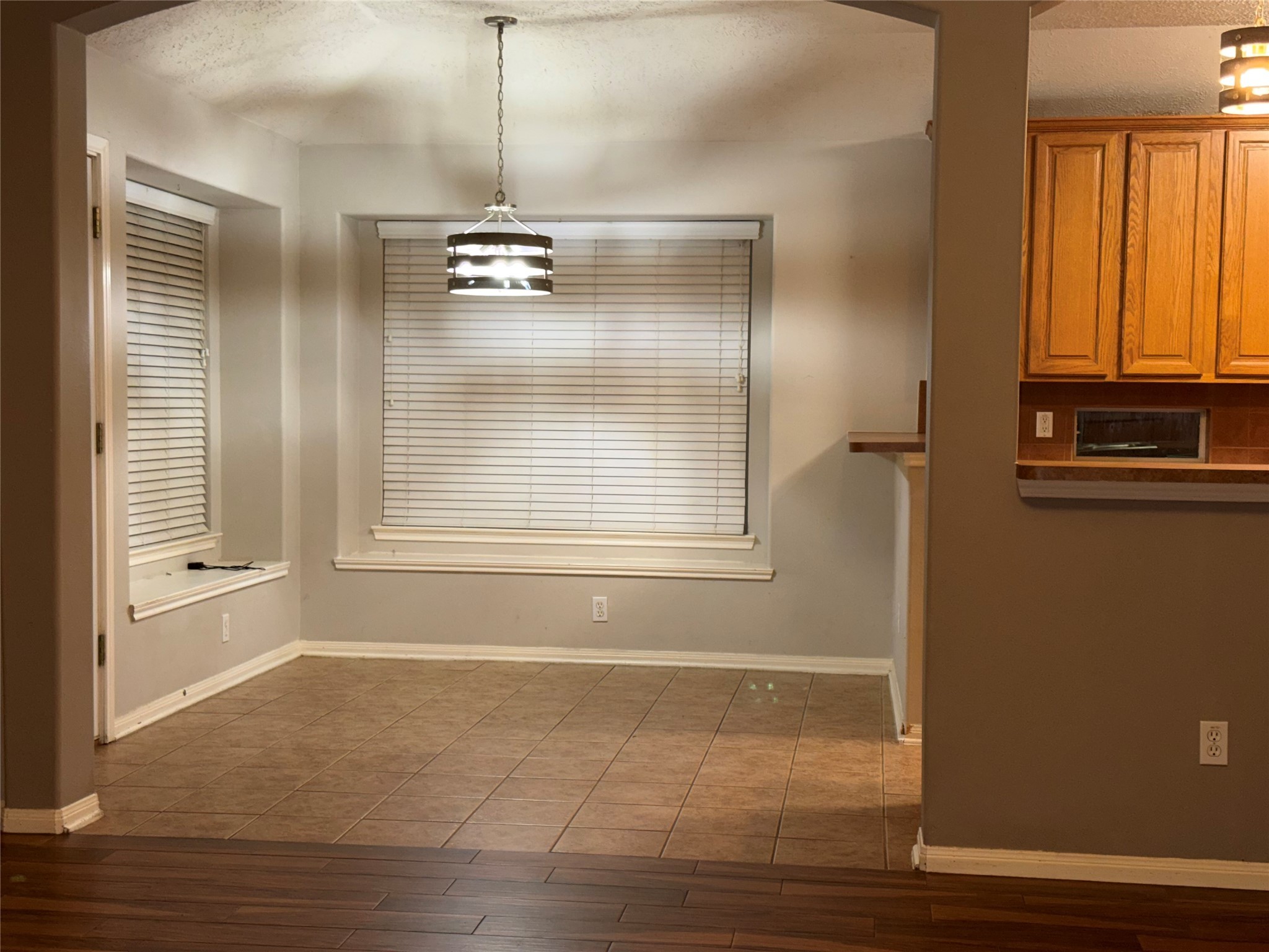 3006 Spring Fair Court Spring, TX 77388 - Photo 11 of 18 a view of an empty room with wooden floor and a window