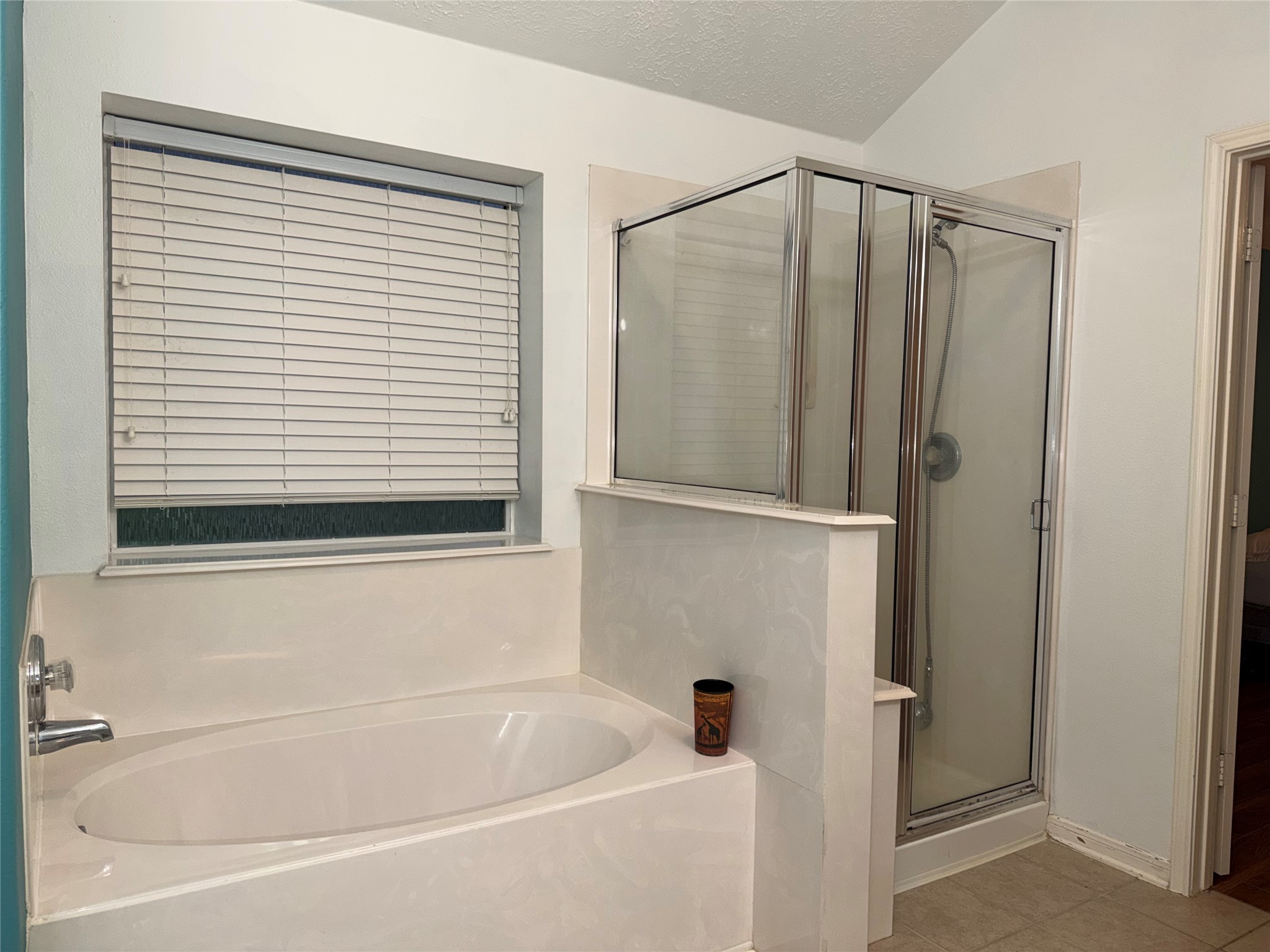 3006 Spring Fair Court Spring, TX 77388 - Photo 15 of 18 a bathroom with a bathtub and a shower