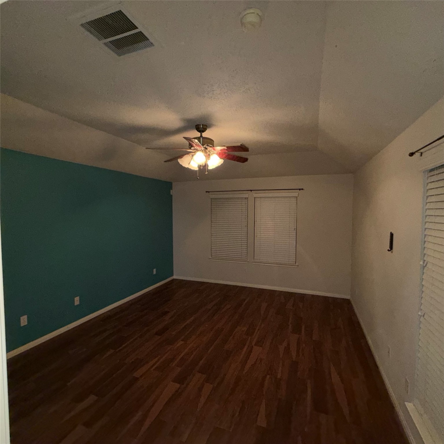 3006 Spring Fair Court Spring, TX 77388 - Photo 17 of 18 a view of a room with wooden floor and chandelier