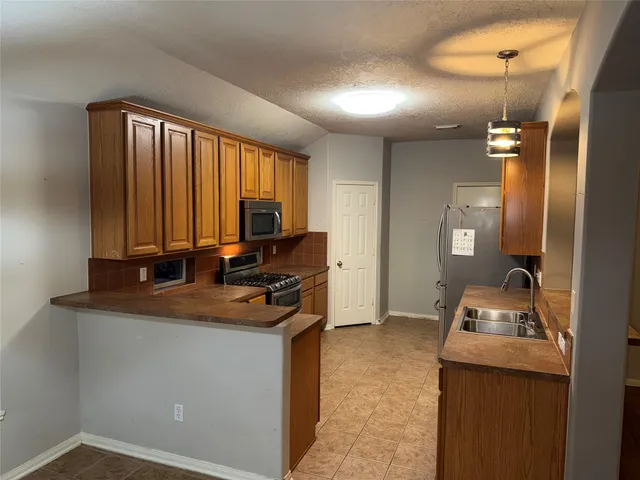 a room with a sink and a window