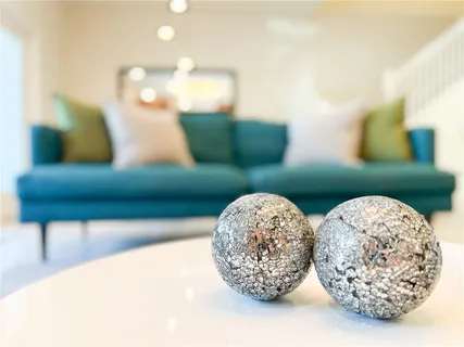 a view of a glass vase of water with dining table