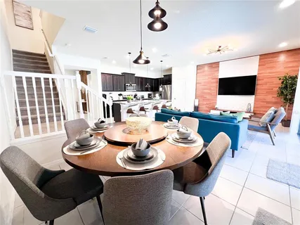 a living room with fireplace furniture and a flat screen tv