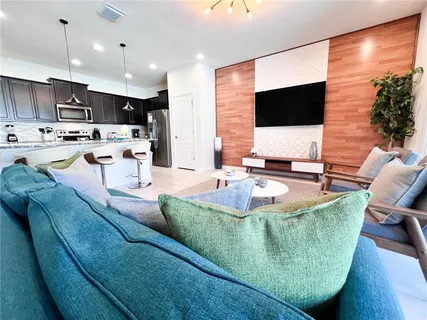 a view of living room with furniture and rug