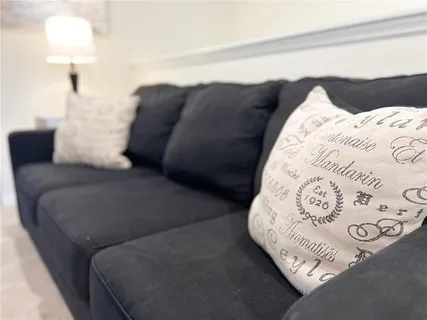 a bedroom with a bed and a couch