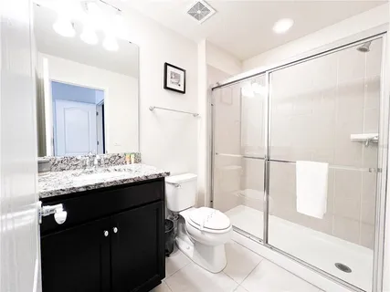 a large white bed in a white room