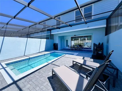 a view of a table and chairs under an umbrella