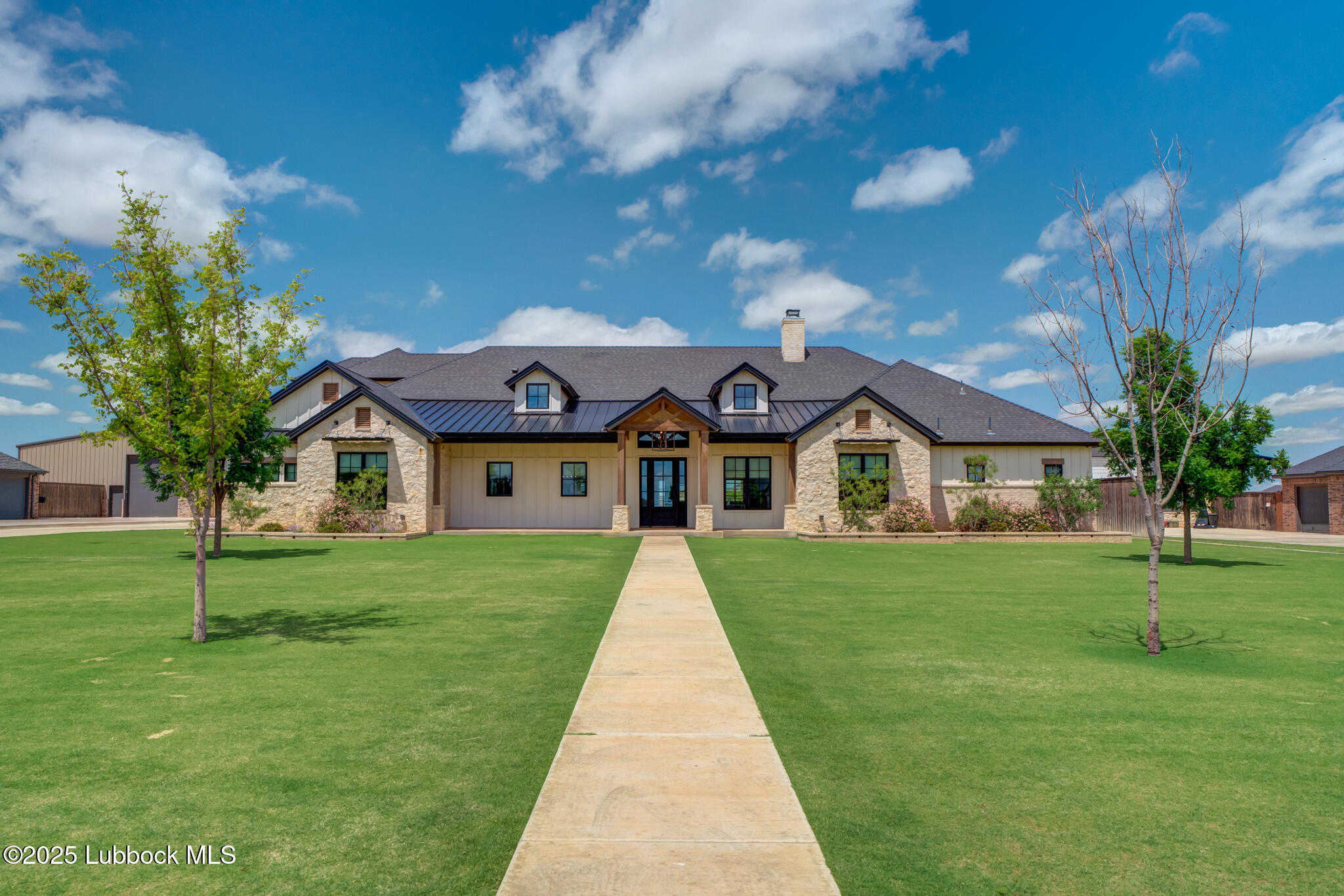 5004 County Road 7640 Lubbock, TX 79424 - Photo 2 of 79 a front view of a house with a yard
