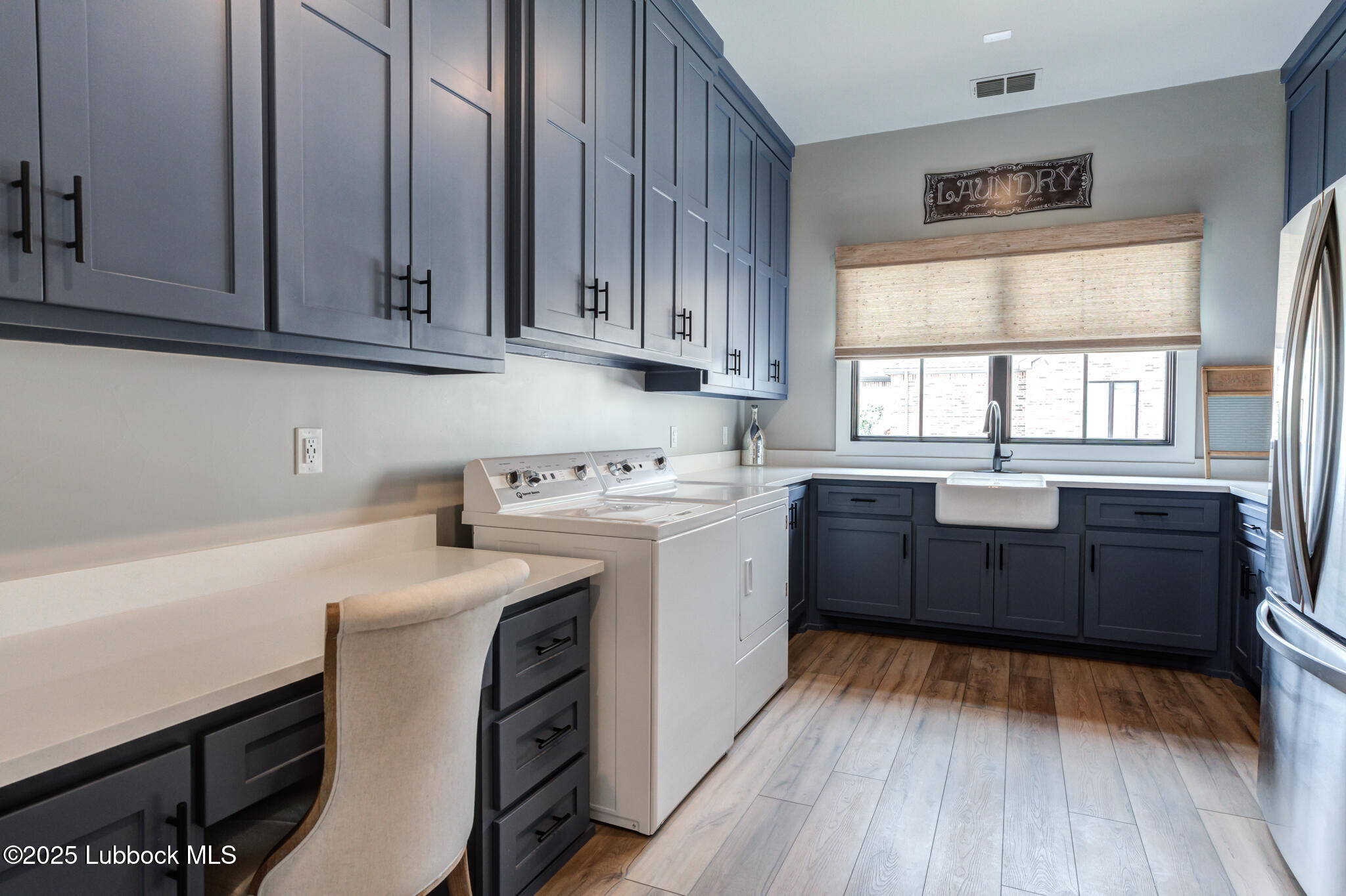 5004 County Road 7640 Lubbock, TX 79424 - Photo 22 of 79 a kitchen with a sink window and cabinets
