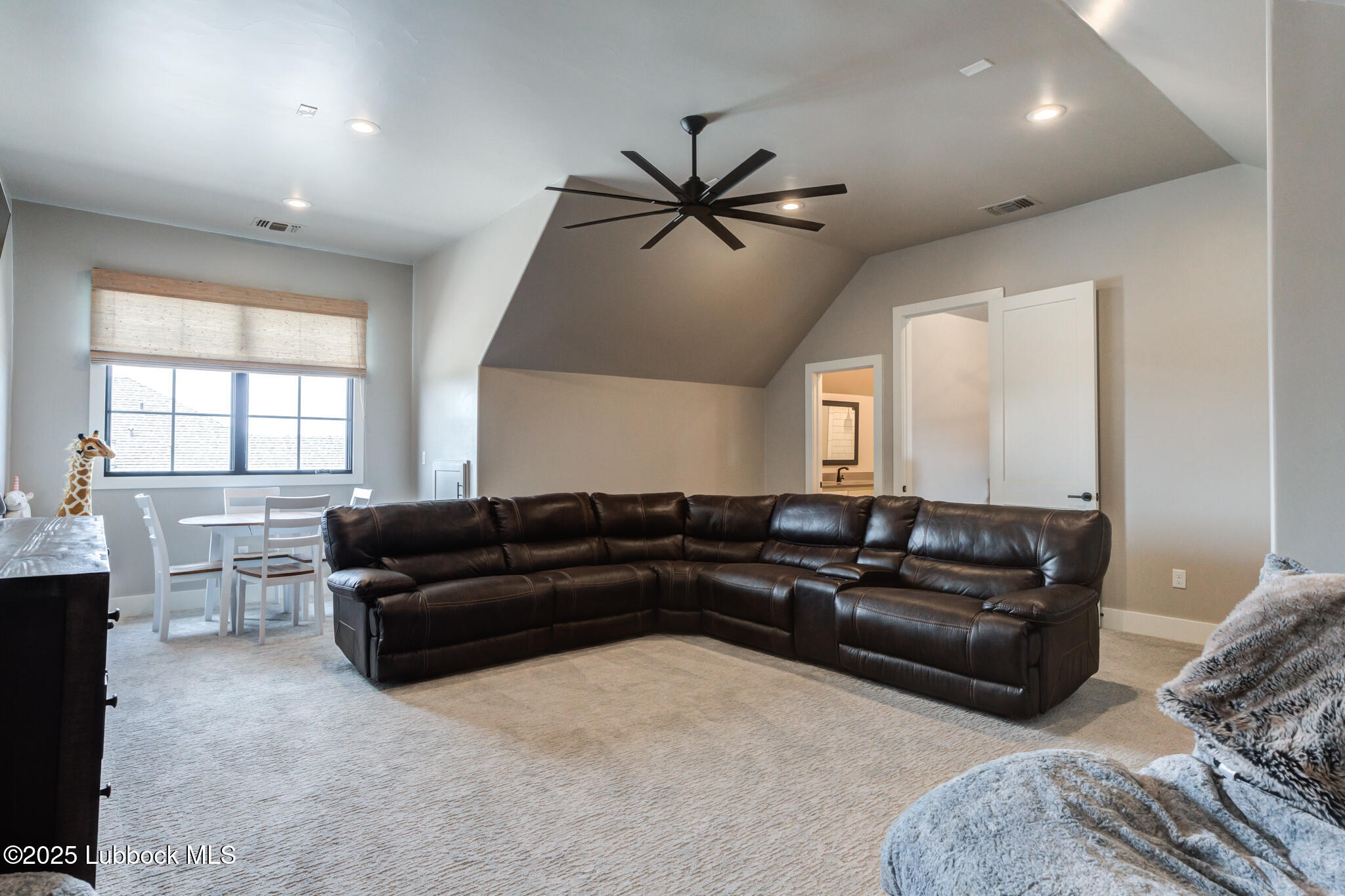5004 County Road 7640 Lubbock, TX 79424 - Photo 30 of 79 a living room with furniture ceiling fan and a window