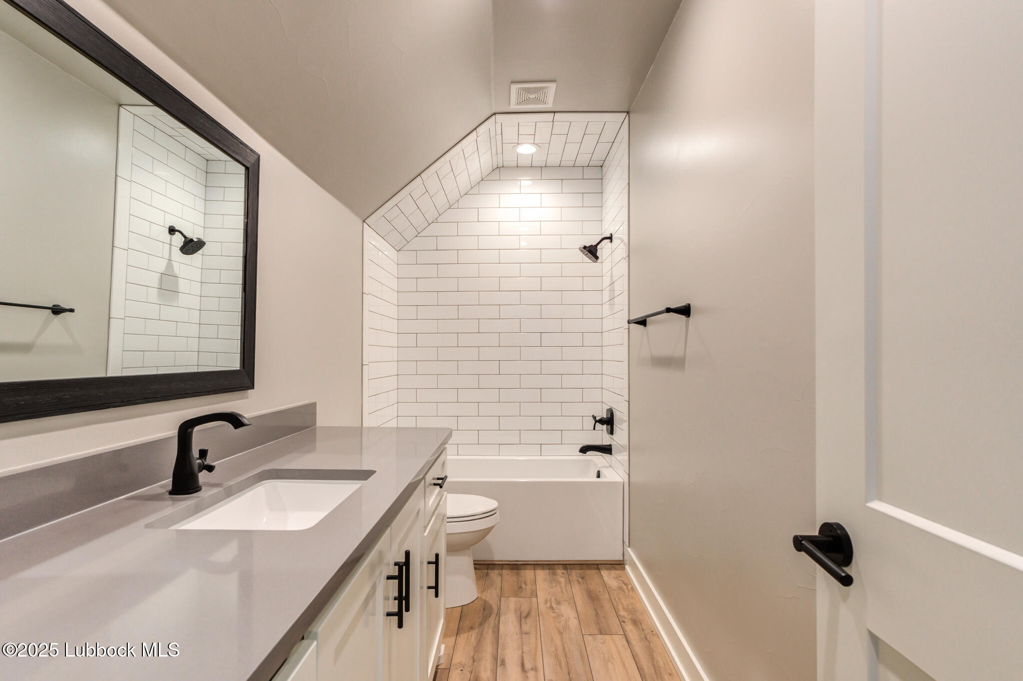 5004 County Road 7640 Lubbock, TX 79424 - Photo 36 of 79 a bathroom with a sink and a mirror