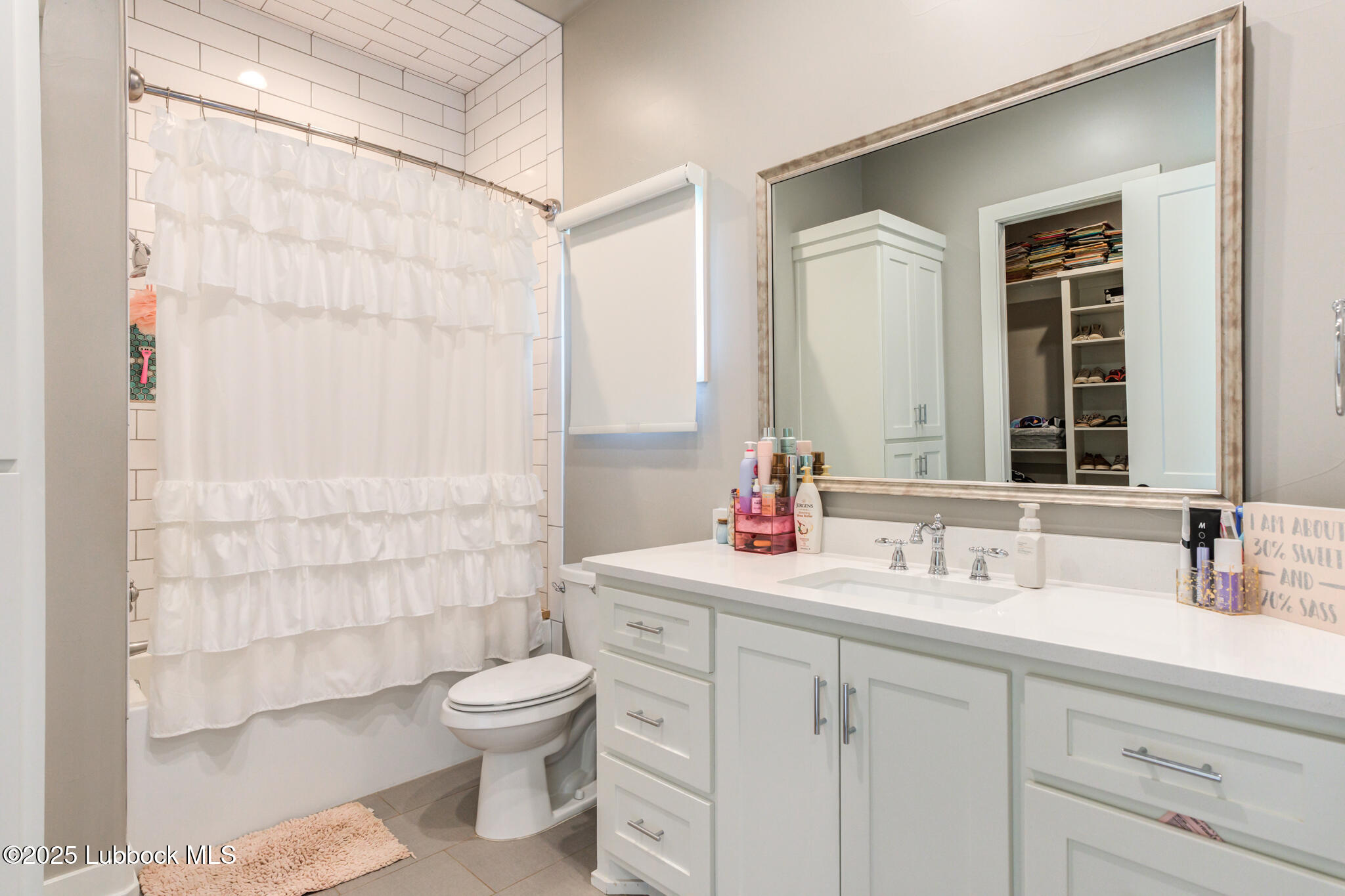 5004 County Road 7640 Lubbock, TX 79424 - Photo 41 of 79 a bathroom with a toilet sink and mirror