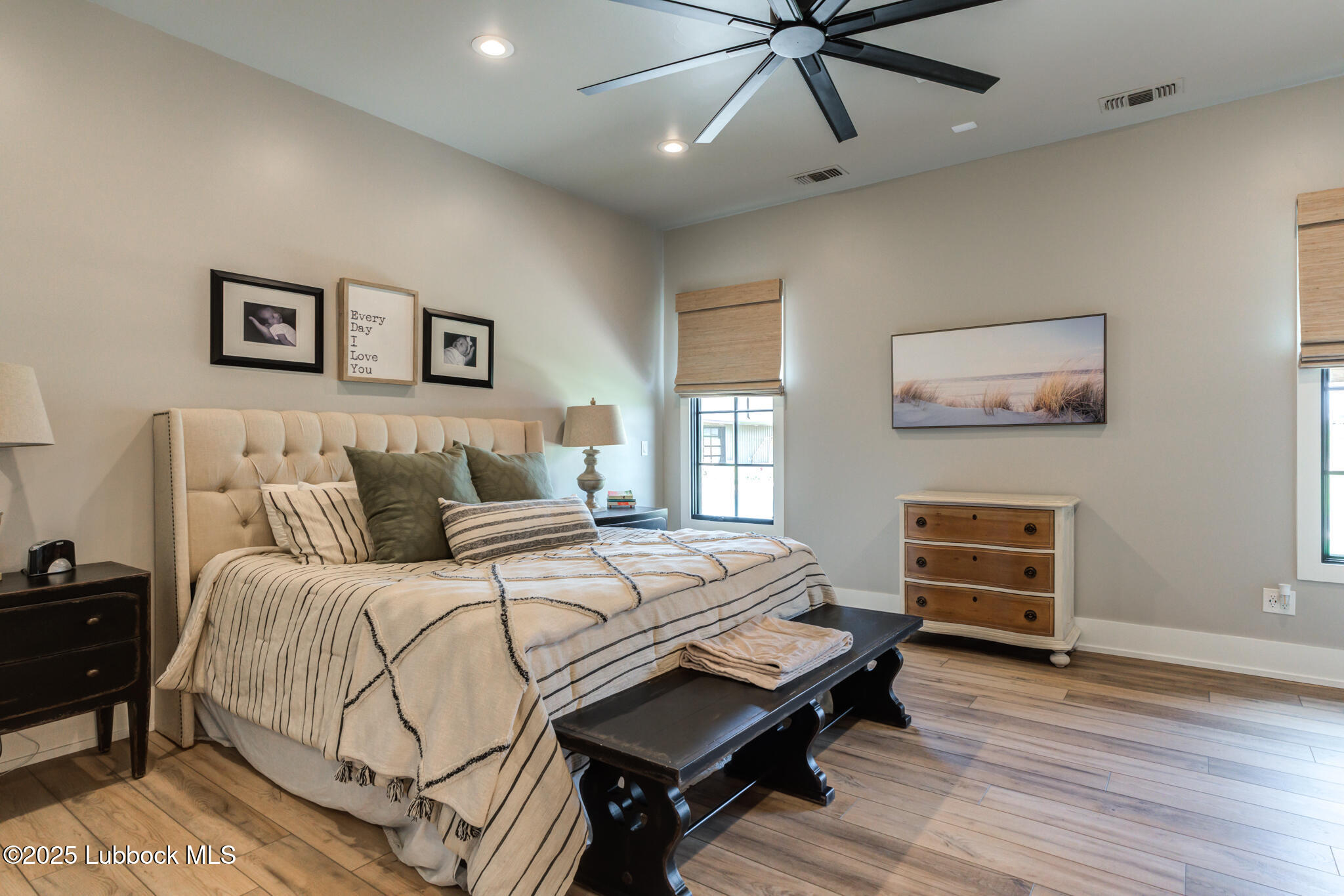 5004 County Road 7640 Lubbock, TX 79424 - Photo 48 of 79 a bedroom with a bed and wooden floor