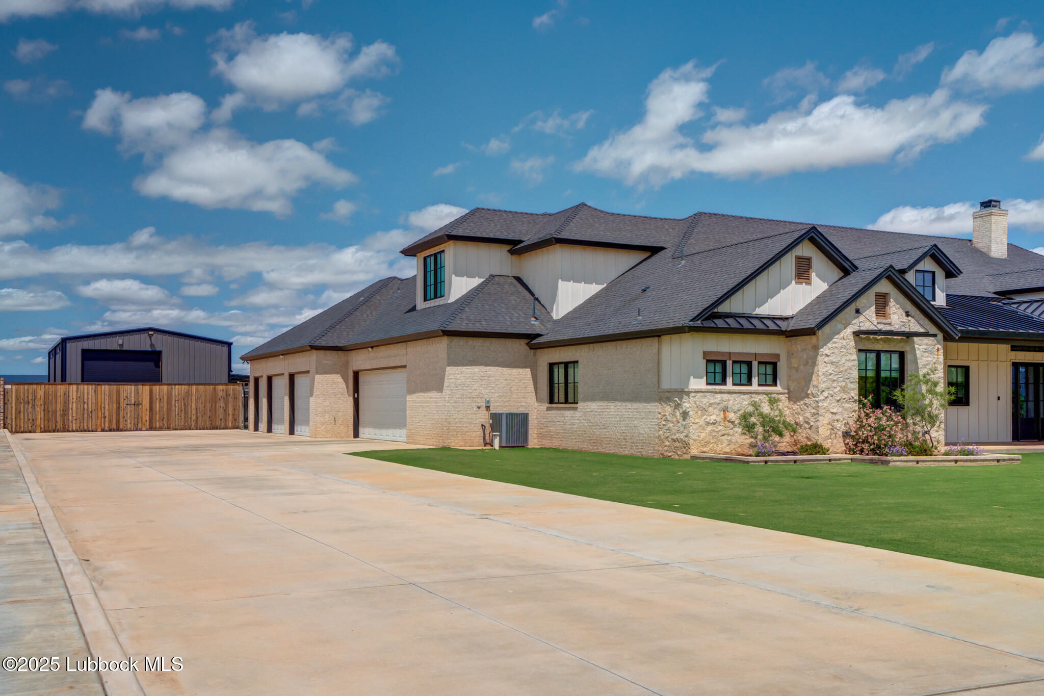 5004 County Road 7640 Lubbock, TX 79424 - Photo 5 of 79 a front view of a house with a yard and garage
