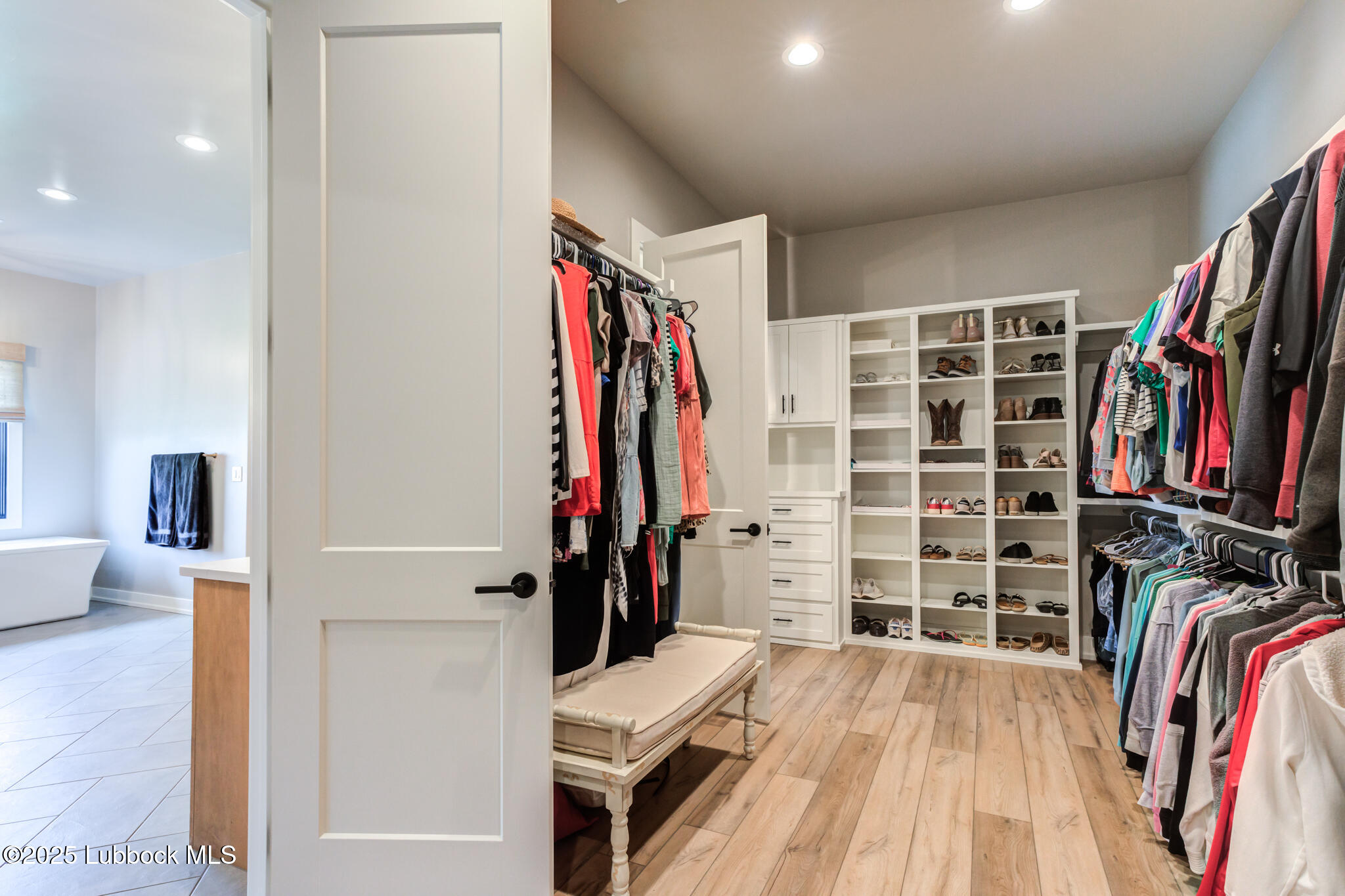5004 County Road 7640 Lubbock, TX 79424 - Photo 57 of 79 a view of walk in closet with clothes and shoes