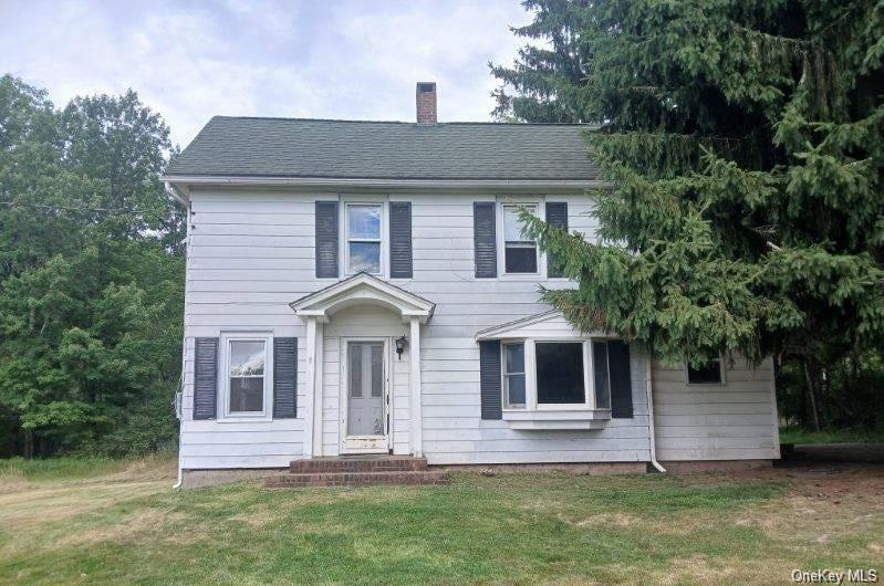 3635 State Rte 55 Bethel, NY 12749 - Photo 1 of 1 Colonial home with a front yard and a chimney