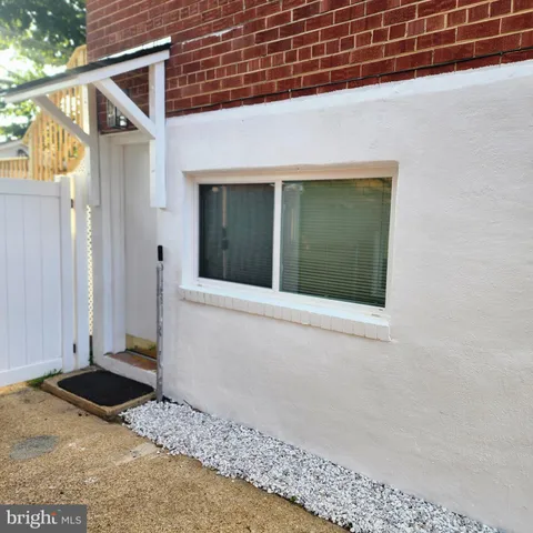 a backyard of a house with large tree
