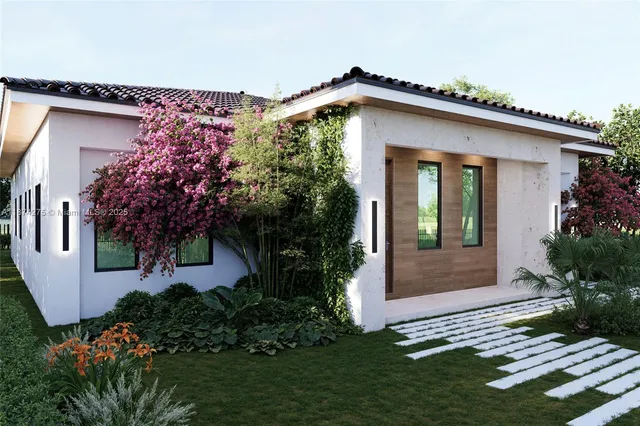 a front view of a house with garden