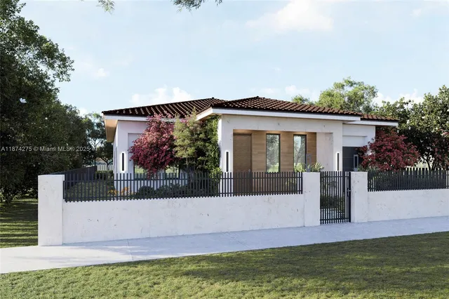 a front view of a house with a garden