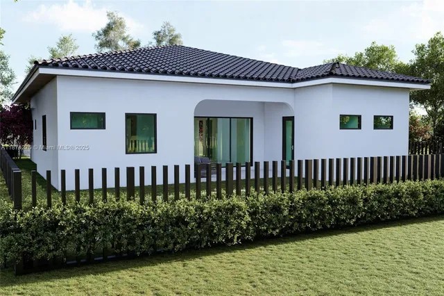 a front view of a house with a garden