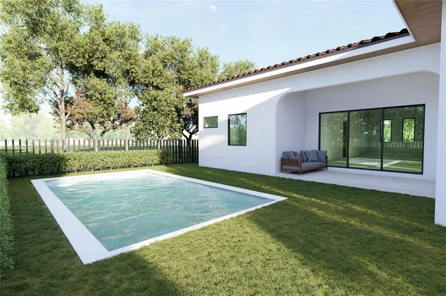 a view of a backyard of the house