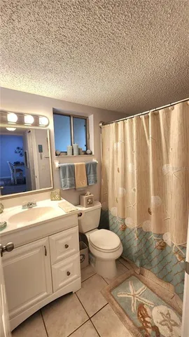 a view of a hallway with furniture and a window