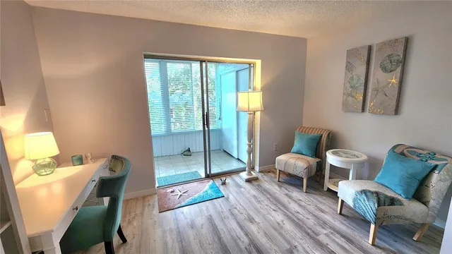 a bedroom with a bed and a potted plant