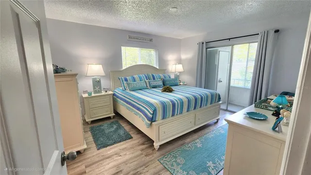 a view of a kitchen with a sink and refrigerator