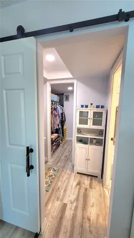 a bathroom with a granite countertop sink toilet mirror vanity and bathtub
