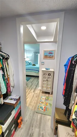 a bathroom with a granite countertop toilet sink and mirror